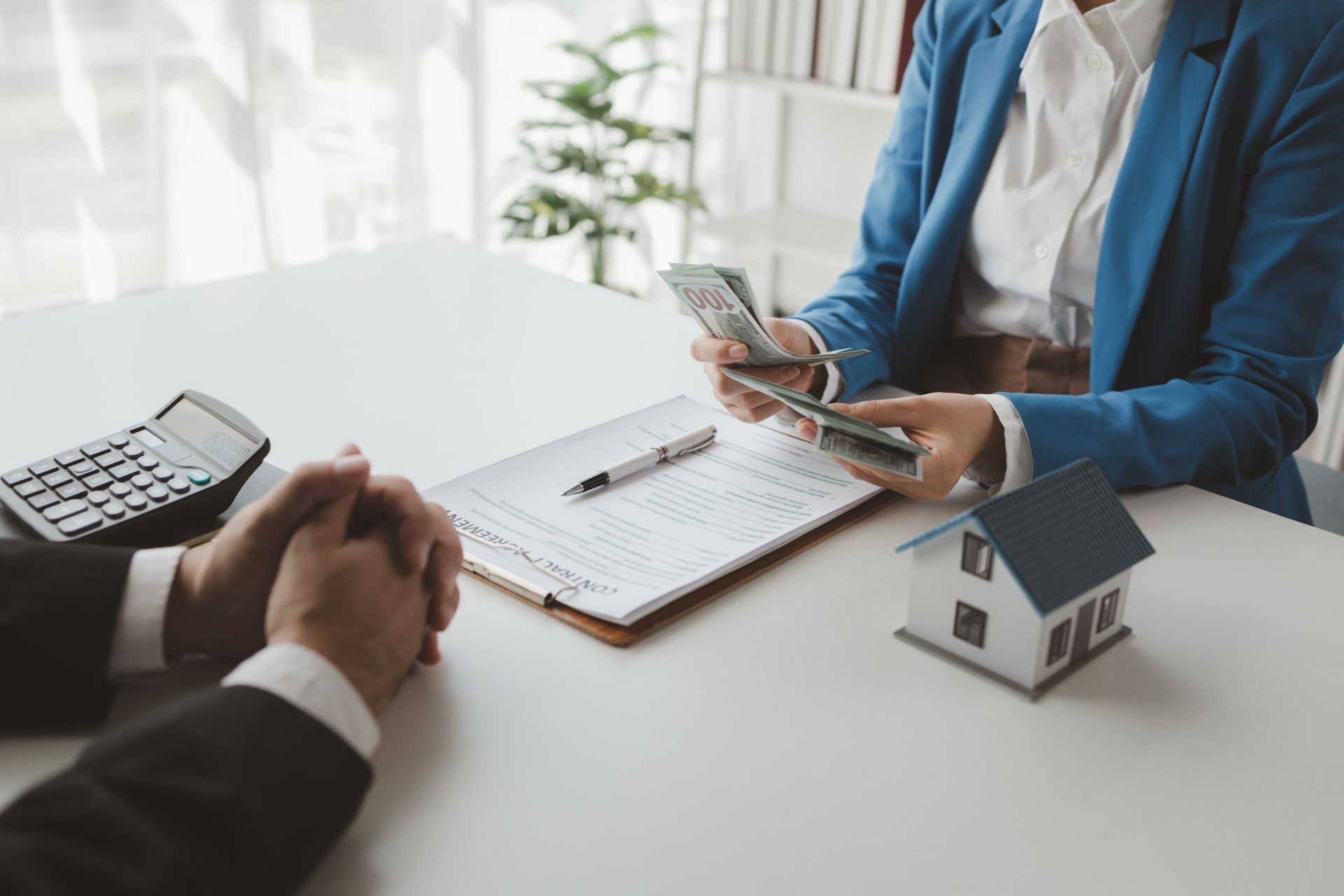 quick loan missouri business meeting with money and contract agreement